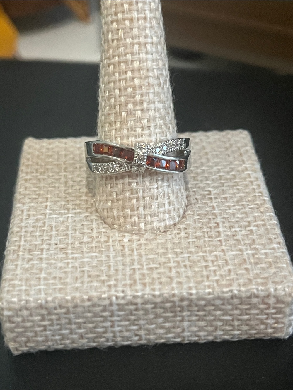 Sterling Silver Bow-Style Ring with Deep Red Channel Stones